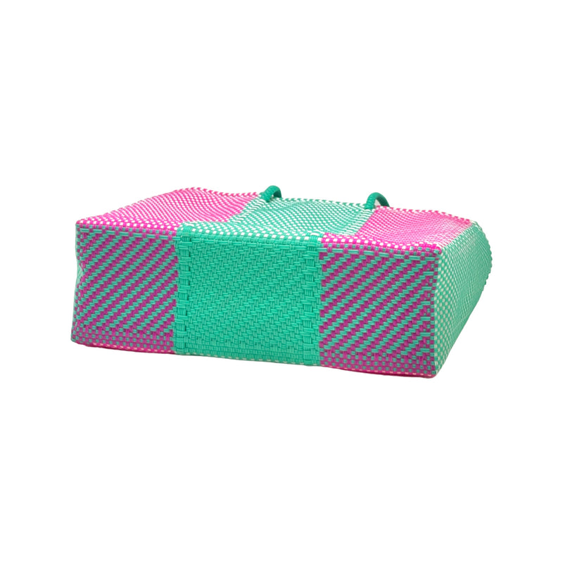 Woven beach tote bag in bright colors. 100% handwoven, made in small batches from recycled plastic.